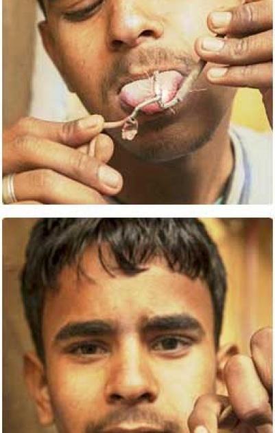 هندي يحترف امتصاص الصدمات الكهربائية