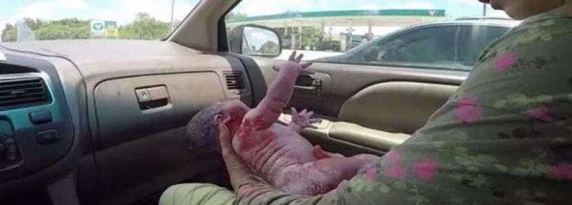 زوج يصور بالفيديو ولادة ابنه بالسيارة