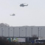 Helicopters with French intervention forces hover above the scene of a hostage taking at an industrial zone in Dammartin-en-Goele, northeast of Paris