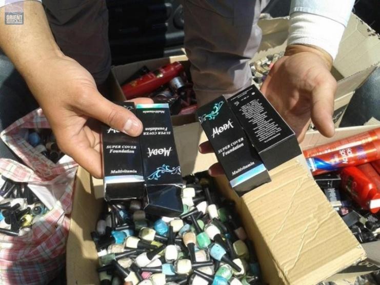 ضبط 1239 علبة مواد تجميل منتهية الصلاحية في جنين