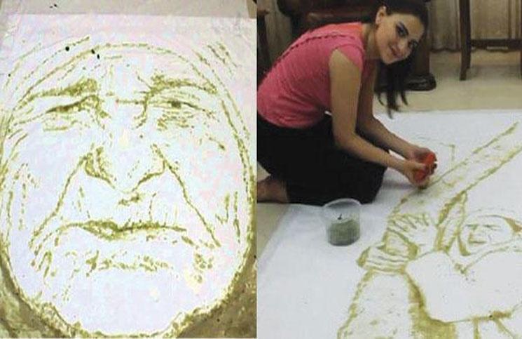 فلسطينية ترسم لوحات فنية بحبات الزيتون