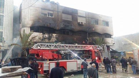 الاحتلال يحرق محل العجولي لصرافة بعد مصادرة امواله