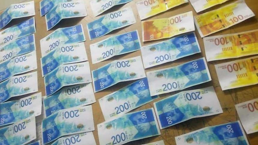 شرطة رام الله تضبط 40 ألف شيقل مزورة بحوزة شخصين في بيرزيت