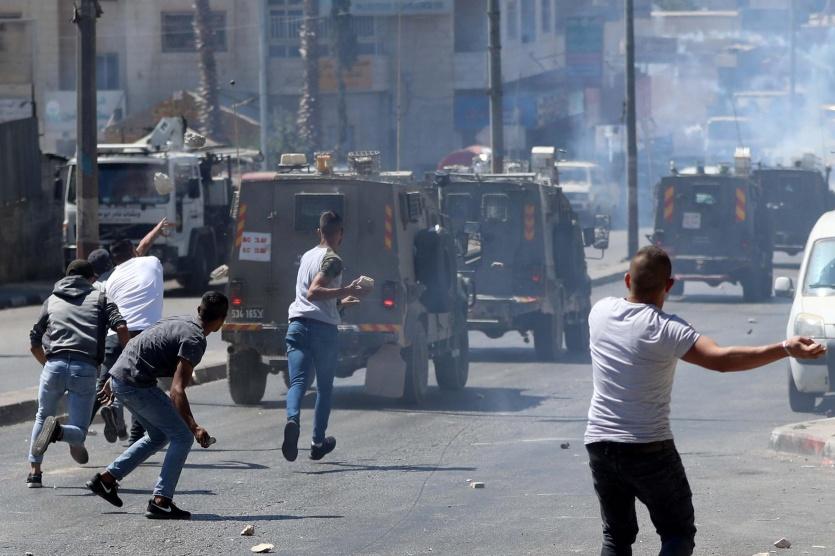 3 إصابات بالرصاص بمواجهات عنيفة مع الاحتلال وسط رام الله