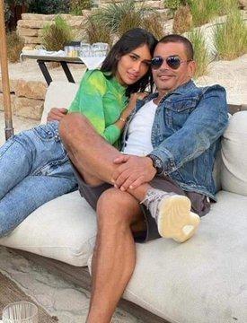 سر ظهور عمرو دياب مع صاحبة الصور المثيرة للجدل